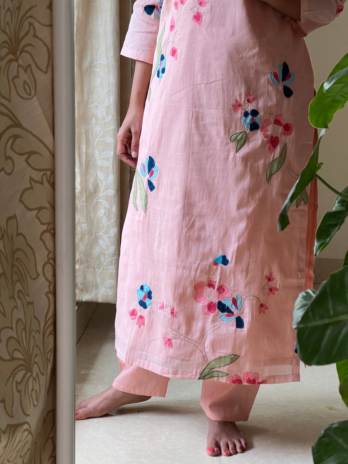 A006 peach Mulmul 2 piece dress with machine embroidery and applique work