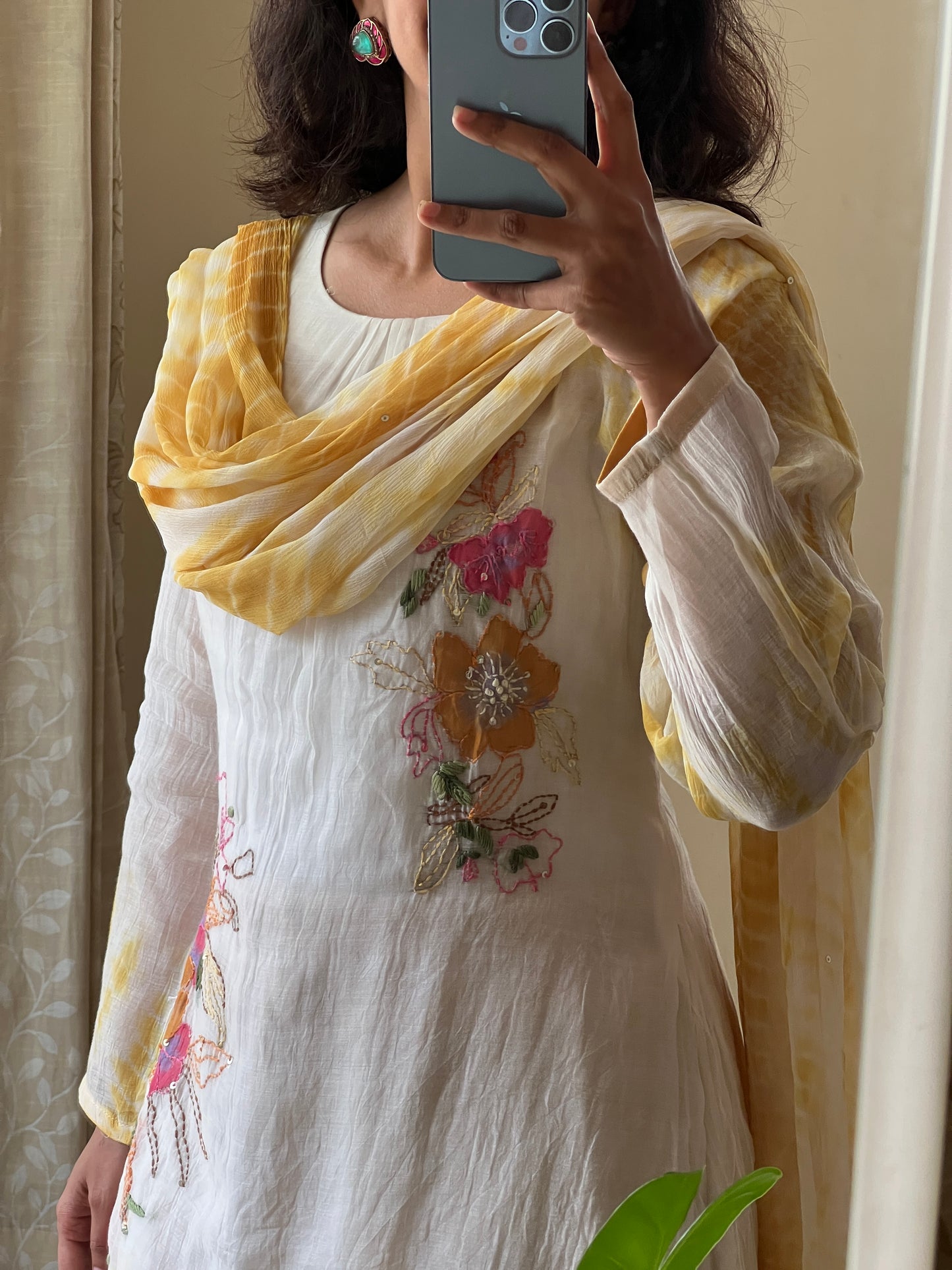 A0502 white & yellow tie dye mul chanderi 3 piece dress with hand paint & embroidery detailing comes with chiffon tie dye duppatta. The best part of this dress is at back part also you have same floral bunch detailing with hand paint & embroidery