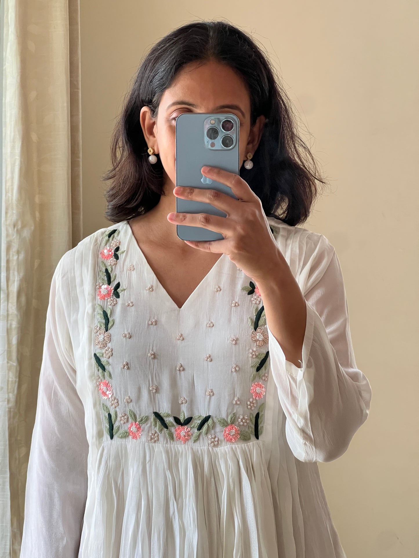 A0450 white chinnon one piece dress with hand embroidery detailing on yoke part