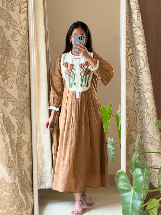 A0358 brown mulmul one piece dress with tulips applique work detailing
