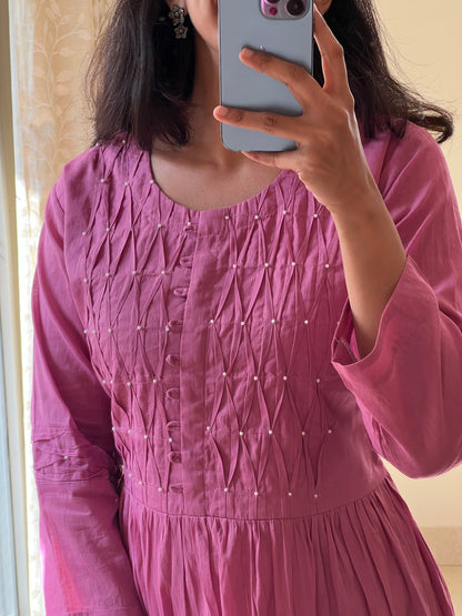 A0547 pink Mulmul one piece dress with rose bunches hand embroidery all over the dress & smocking detailing over yoke part