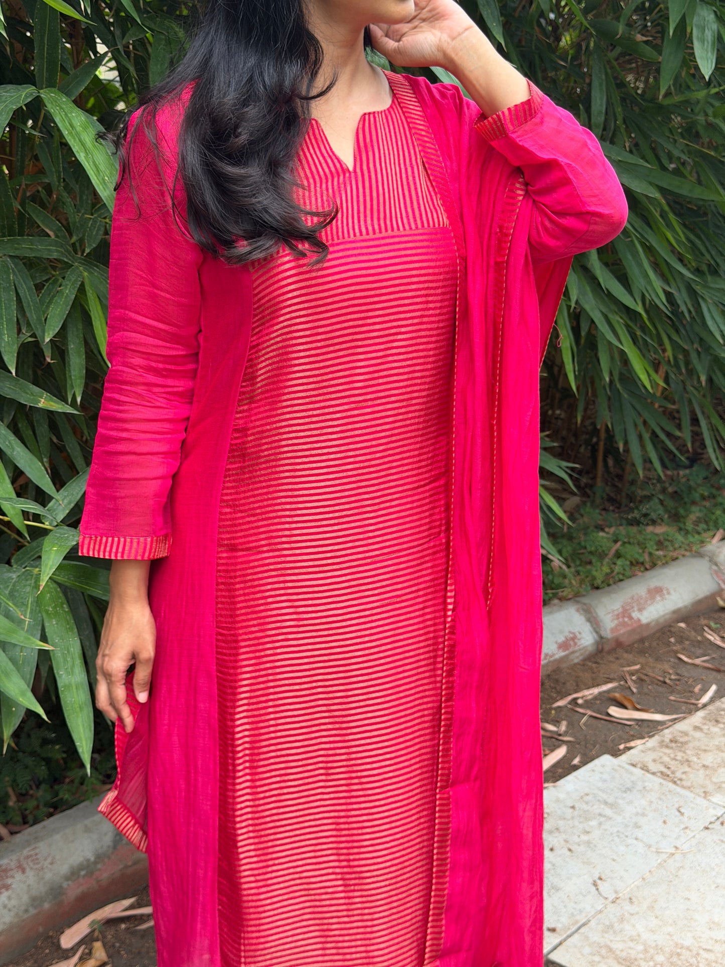 A0772 Rani pink Mul Chanderi 3 piece suit with golden stripes Mul Chanderi fabric detailing all over the dress & comes with border all over the dress