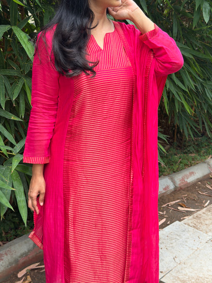 A0772 Rani pink Mul Chanderi 3 piece suit with golden stripes Mul Chanderi fabric detailing all over the dress & comes with border all over the dress