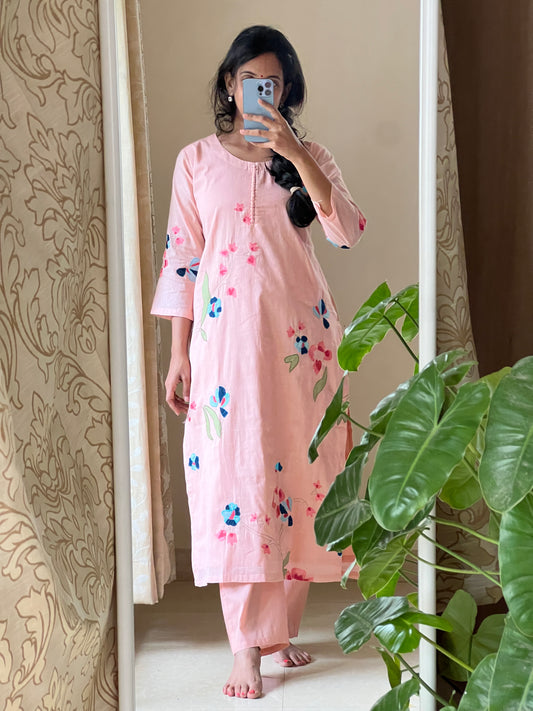 A006 peach Mulmul 2 piece dress with machine embroidery and applique work