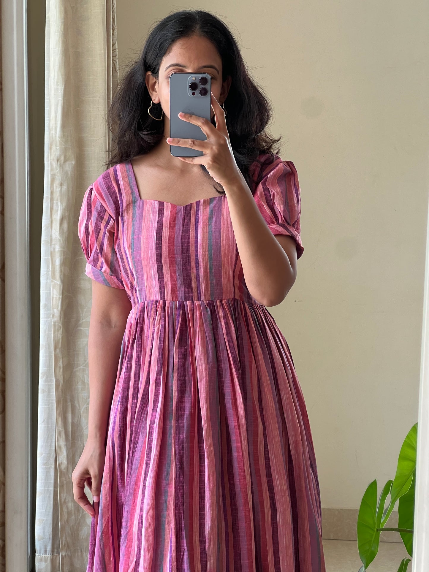 A0525 pink handloom cotton one piece dress in stripes and gathering at bottom of the dress