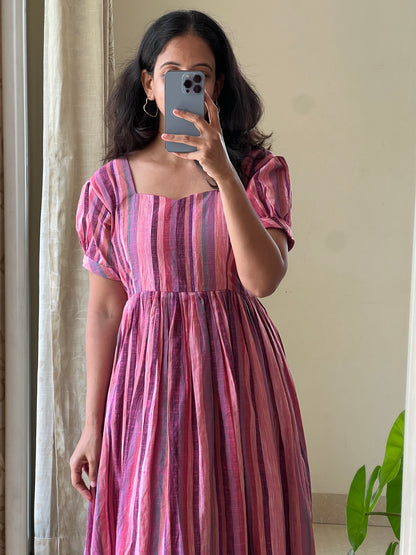 A0525 pink handloom cotton one piece dress in stripes and gathering at bottom of the dress