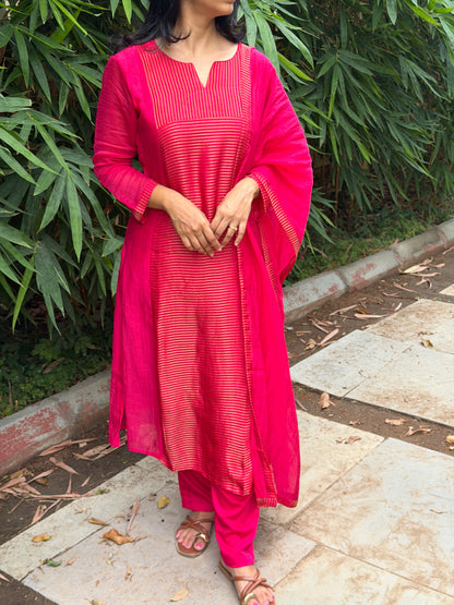 A0772 Rani pink Mul Chanderi 3 piece suit with golden stripes Mul Chanderi fabric detailing all over the dress & comes with border all over the dress