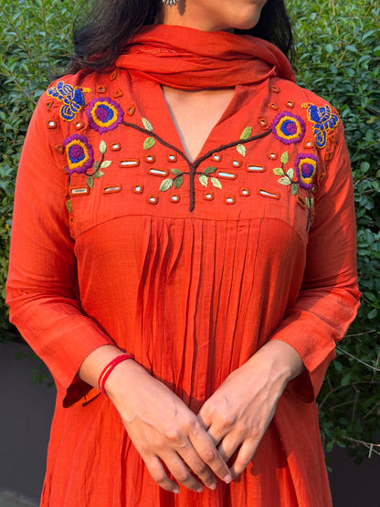 A0659 orange mul chanderi 3 piece dress with hand, mirror embroidery on yoke part, these are one sizes down so go for one size up