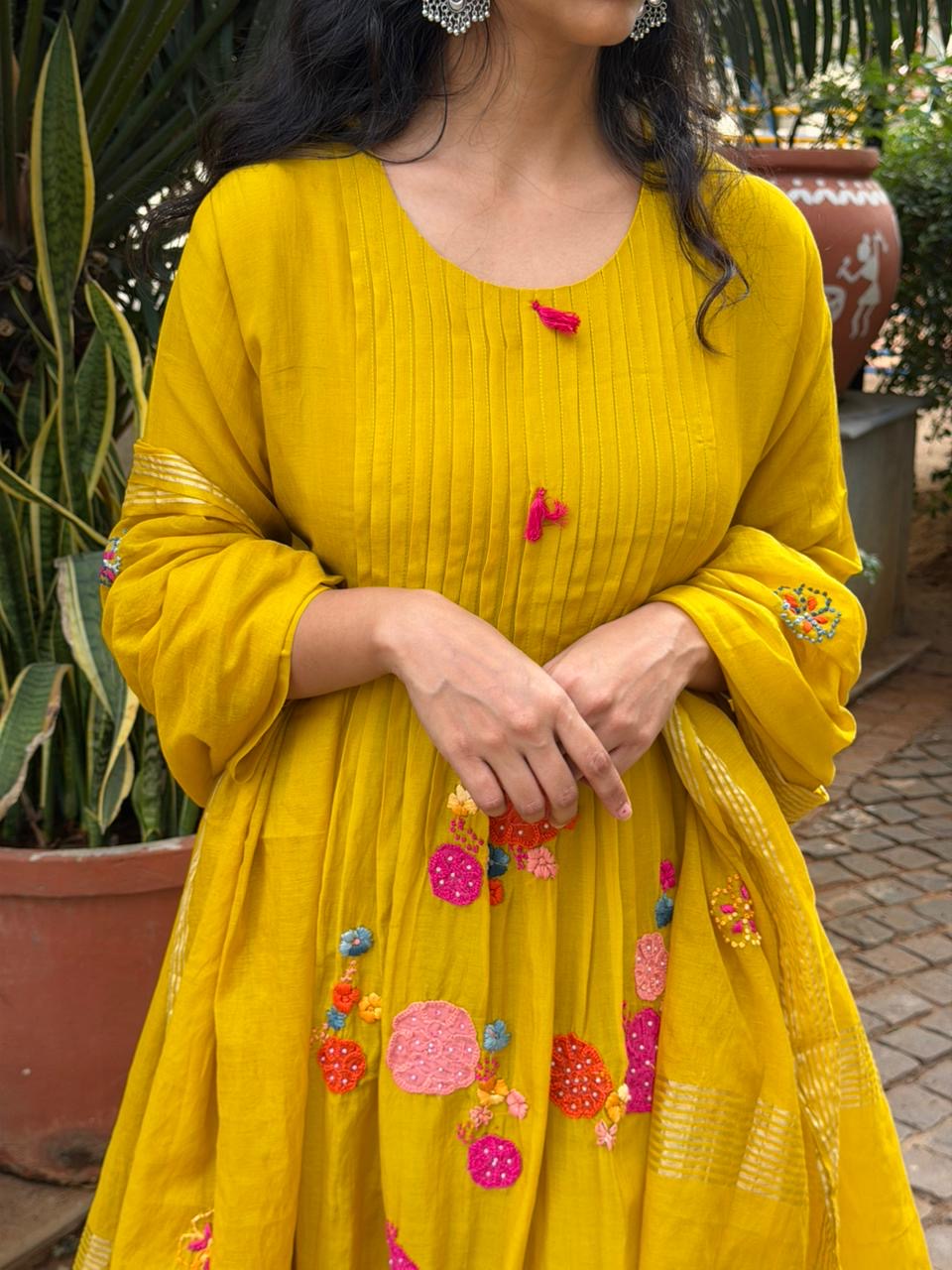 A0621 mustard mul chanderi 3 piece suit with applique, hand embroidery & pleats over the yoke part & butties all over the duppatta