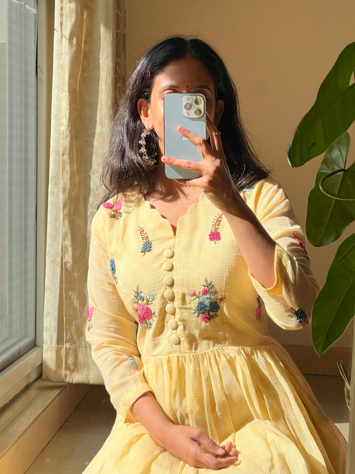 A0463 yellow Kota one piece dress with hand embroidery detailing all over the dress