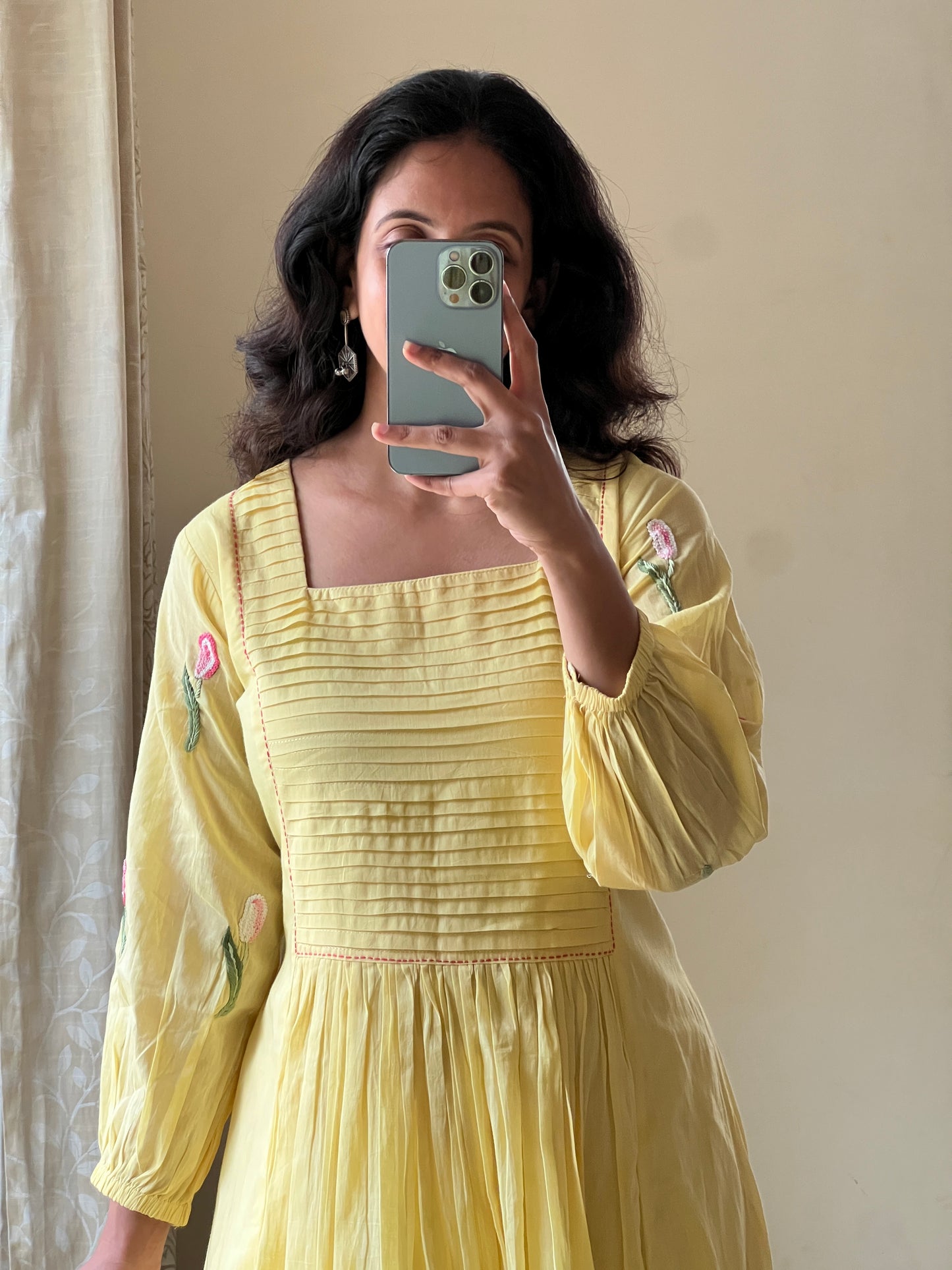 A0488 yellow Mulmul one piece dress with hand embroidery detailing at the bottom & pleats at the yoke part