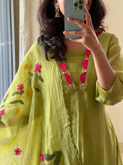 A0522 green Mulchanderi 3 piece dress with multi colour applique work detailing at the bottom of the dress