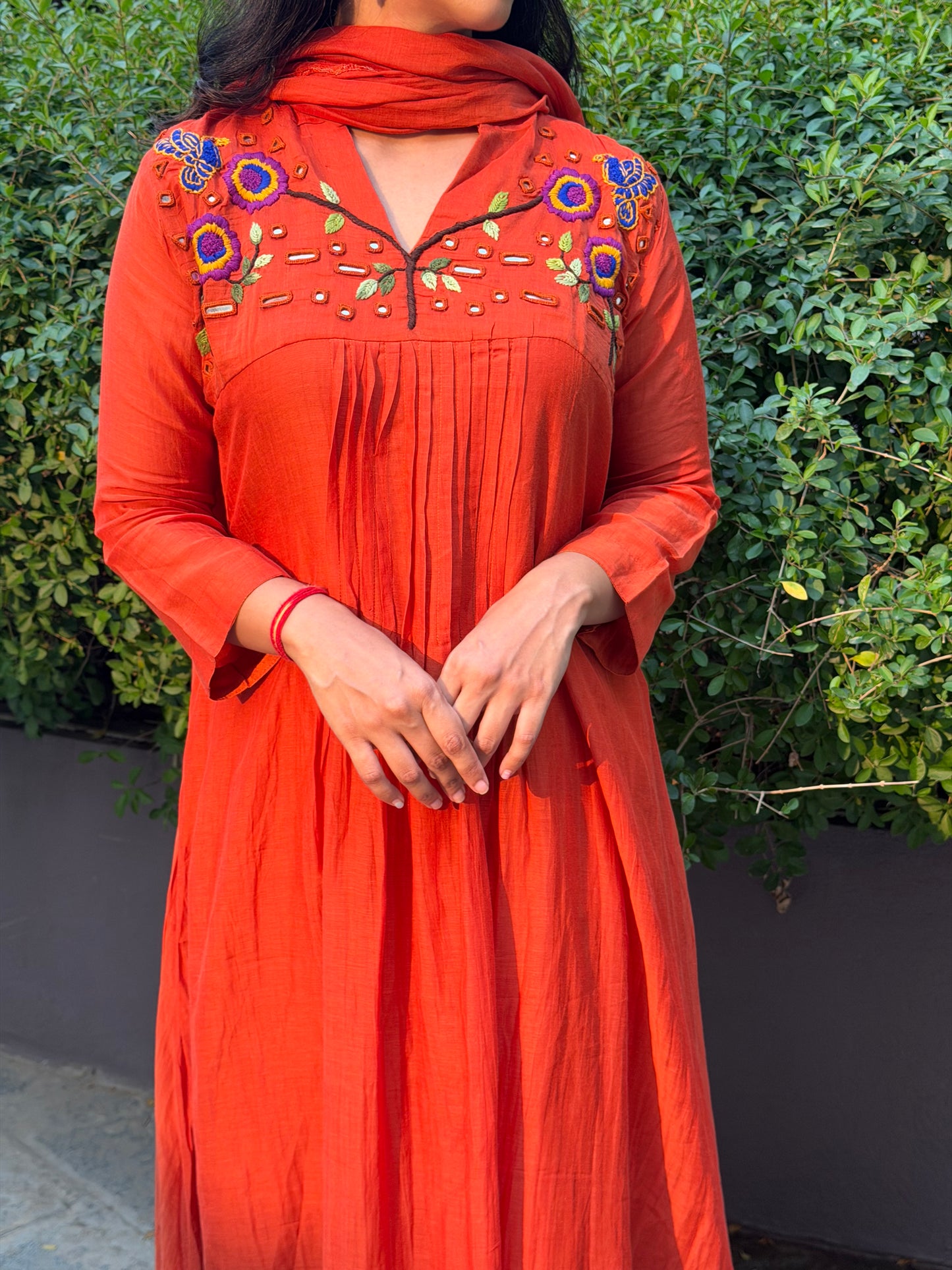 A0659 orange mul chanderi 3 piece dress with hand, mirror embroidery on yoke part, these are one sizes down so go for one size up