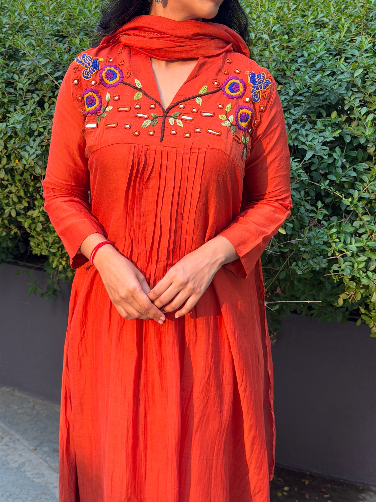 A0659 orange mul chanderi 3 piece dress with hand, mirror embroidery on yoke part, these are one sizes down so go for one size up