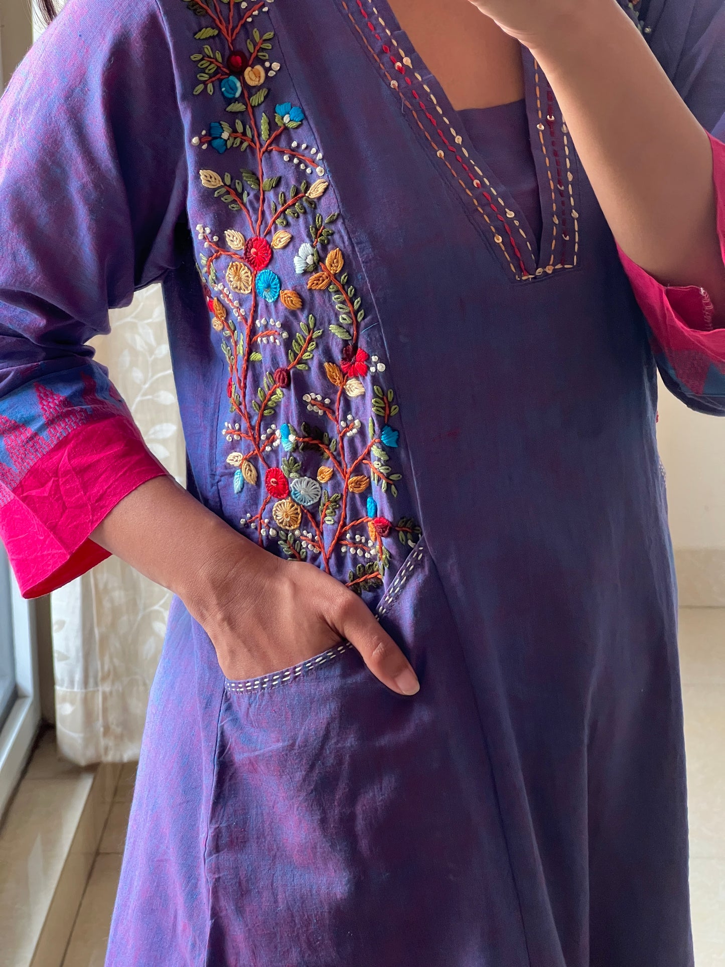 A0591 blue handloom cotton one piece dress with hand embroidery detailing over the pockets & v neck with Kantha work detailing