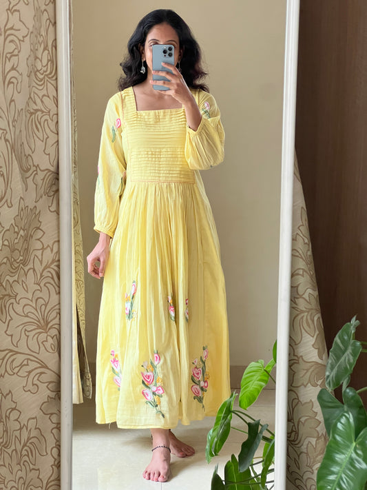A0488 yellow Mulmul one piece dress with hand embroidery detailing at the bottom & pleats at the yoke part