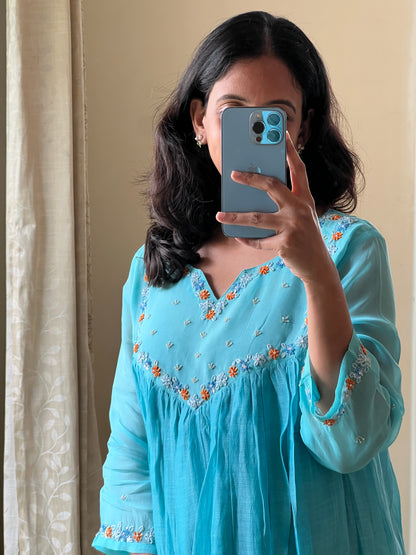 A0494 blue mul chanderi one piece dress with hand embroidery detailing on organza yoke part & hands
