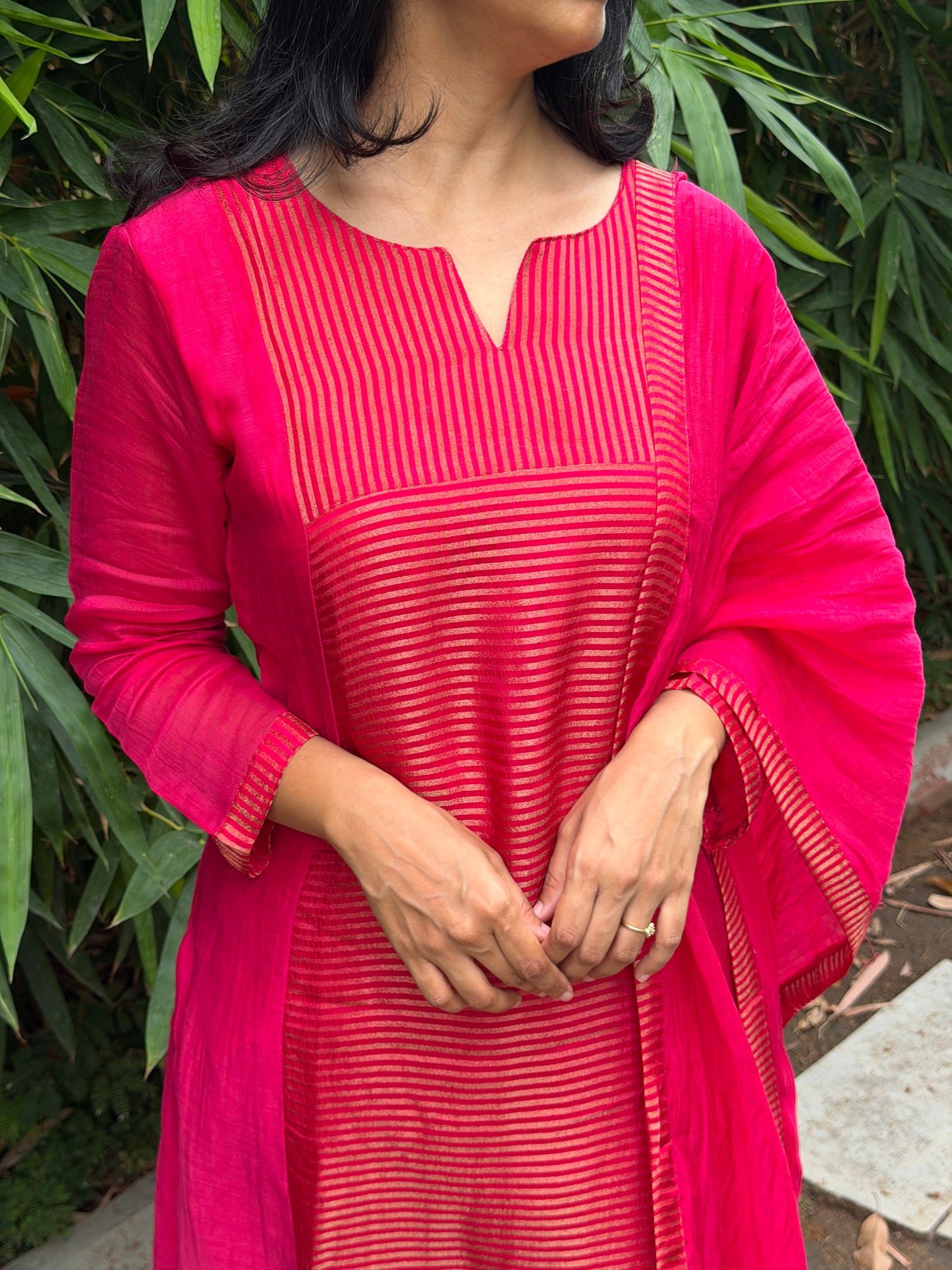 A0772 Rani pink Mul Chanderi 3 piece suit with golden stripes Mul Chanderi fabric detailing all over the dress & comes with border all over the dress