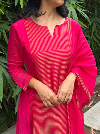A0772 Rani pink Mul Chanderi 3 piece suit with golden stripes Mul Chanderi fabric detailing all over the dress & comes with border all over the dress