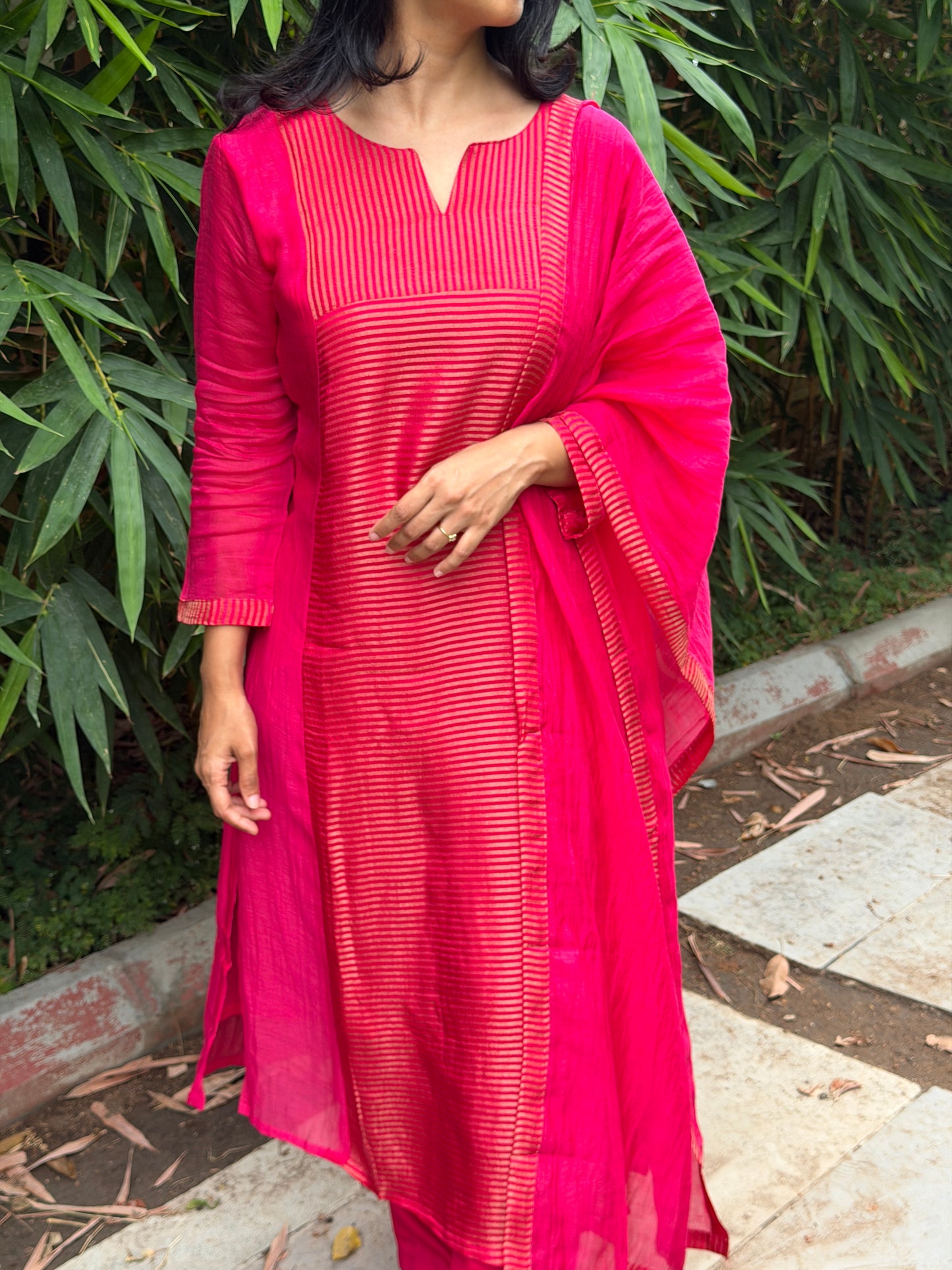 A0772 Rani pink Mul Chanderi 3 piece suit with golden stripes Mul Chanderi fabric detailing all over the dress & comes with border all over the dress