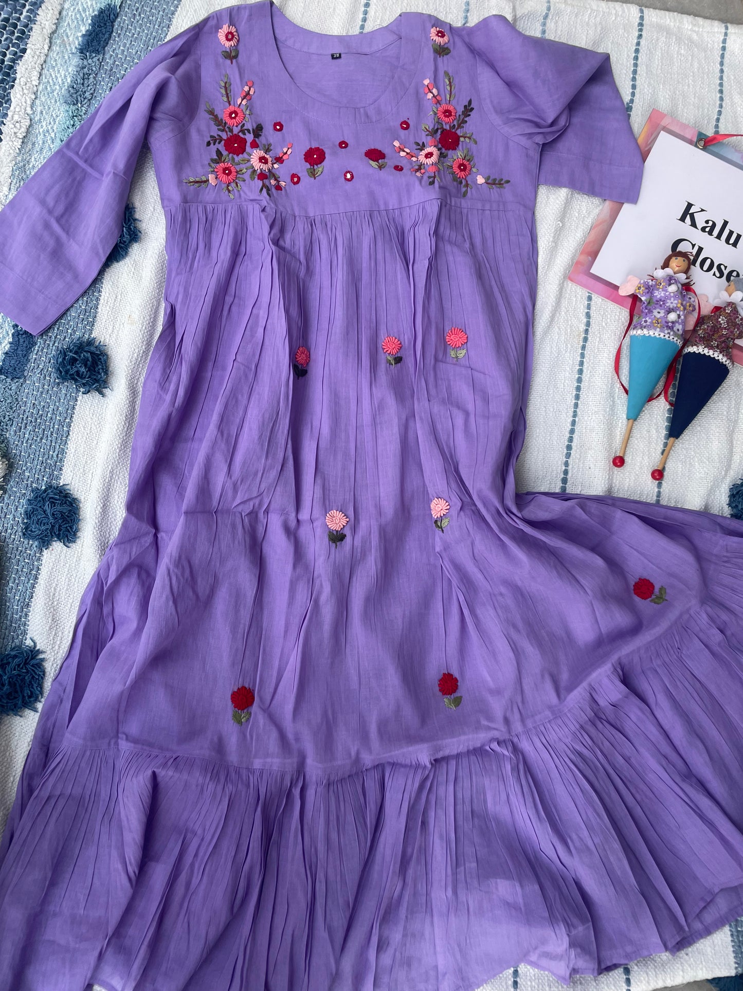 The lavender hues in Mulmul cotton with hand embroidery detailing all over the dress
