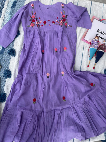 The lavender hues in Mulmul cotton with hand embroidery detailing all over the dress