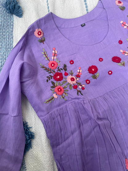 The lavender hues in Mulmul cotton with hand embroidery detailing all over the dress
