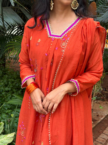A0657 rust orange Mul chanderi 3 piece dress with embroidery detailing butties all over the dress